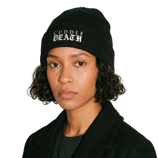 Model wearing the LOGO BEANIE on a white background