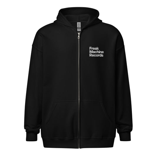 Freak Machine Records Zip Hoodie in black featuring the brand logo and a comfortable fit. Stylish zip-up hoodie for fans of Freak Machine Records and music enthusiasts.